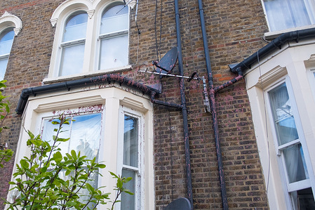 An exterior view of house vandalized with red and black paint in Kilburn. A house on Lowfield Road was targeted in what appears to be a similar attack to instances of vandalism in Walthamstow and other areas in England in 2025, in which red paint and the word 'brothel' was daubed on the houses.