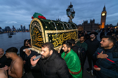 Worshippers seen carrying the coffin. Shia Muslims gathered at Westminster Bridge to commemorate the martyrdom of Imam Musa al-Kazim taking part in a religious procession marked by ritual chest beating known as Azadari and Matam. The annual observance honours the seventh Shia Imam and serves as a public expression of mourning, sacrifice, and devotion within the Shia Islamic tradition.