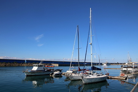 Yachts and boats are moored in the Black Sea, in the Sochi Imereti Seaport in Sochi, in the Krasnodar Territory, the Russian Federation.