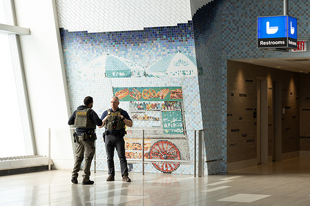 ICE agents are seen stationed at LaGuardia Airport. A partial government shutdown has resulted in callouts by unpaid TSA agents. President Trump called in ICE to assist with operations at 13 airports across the country.