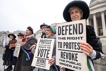 Protesters holding placards reading "Defend the right to protest, revoke the public order act" during the rally. Climate activists dressed as suffragettes gathered on the steps of the National Gallery in Trafalgar Square, London, ahead of International Women’s Day during a protest organised by Fossil Free London. Demonstrators called for the revocation of the Public Order Act, warning that recent legislation represents a rollback of protest rights in the UK. Activists referenced the sentencing of Just Stop Oil campaigners Phoebe and Anna, who received a combined three-year prison sentence for damaging the frame of a Van Gogh painting with soup, drawing comparisons with suffragette Mary Richardson, who served six months in prison in 1914 for slashing a Velázquez painting in the National Gallery.