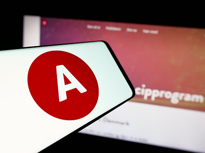 In this photo illustration, a smartphone with the logo of Danish political party Socialdemokraterne (S) is seen on screen in front of website.