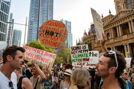 Protesters hold placards during the demonstration.
Thousands of climate change protesters surround Sydney's Town Hall as the bush-fire crisis continues in Australia. Similar protests took place across other state capitals.