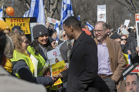 NEW YORK, NEW YORK - FEBRUARY 23: U.S. Rep. Ritchie Torres talks to an attendee during a rally to mark 506 days in Hamas captivity at Naumburg Bandshell at Central Park on February 23, 2025 in New York City.