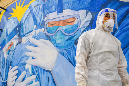 A medical personnel from Ajwa private clinic wears a personal protective equipment (PPE) suit seen during a Covid-19 drive-thru screening test at Shah Alam.

Ismail Sabri Yaakob the Malaysia Senior Minister has announced that all states in Malaysia will be on Movement Control Order (MCO) except the state of Sarawak. Malaysia had recorded 3,631 new cases of Covid-19 today which bring the total up to 165,371 cases.