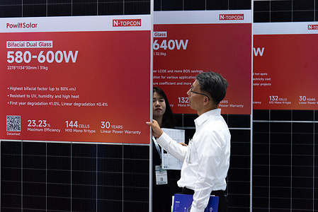 A visitor inspects solar panels during the Asia Sustainable Energy Week 2025 at the Queen Sirikit National Convention Center. The Asia Sustainable Energy Week 2025 is held at the Queen Sirikit National Convention Center. It is a showcase of renewable energy innovations and environmental technologies aimed to decarbonizing the mobility ecosystem so as to achieve net zero greenhouse gas emissions.