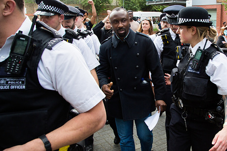 A man who was detained in an immigration van for several hours during an immigration raid at Evan Cook Close, Queens Road Peckham being released. The Nigerian man who was arrested for immigration offences was released on bail after hundreds of protestors gathered at the scene of the immigration raid in Peckham.