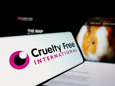 In this photo illustration, a smartphone with the logo of organization Cruelty Free International is seen on screen in front of website.