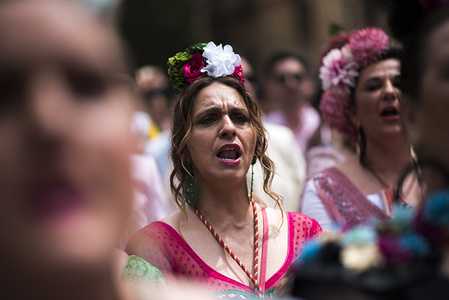 A woman seen singing during the procession of El Rocio in Granada.The “Romeria del Rocio” is one of the most popular festivities in Andalusia, thousands of pilgrims go to Almonte village (Huelva) to worship Virgen del Rocio.