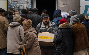 SOPA Images - Gallery - People queue for humanitarian aid in ...