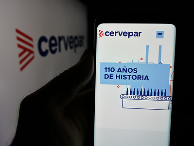 In this photo illustration, a smartphone with the website of company Cerveceria Paraguaya S.A. (Cervepar) is seen on screen in front of logo.