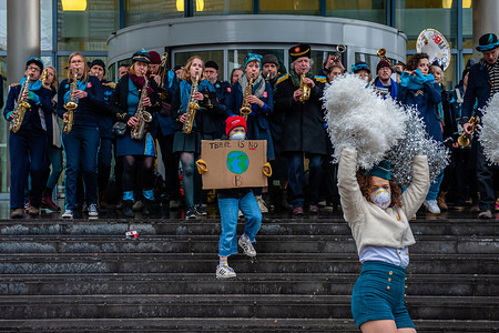 A band seen playing music with a boy holding a placard that says 'There is not Planet B' during the
"Rise for Climate Belgium" protest march organized with the support of Greenpeace and Climate Express. Protesters sought to challenge the Belgian government as well as the heads of state who will attend the European Council summit in Brussels. The march started at the Gare du Nord, and ended at the Place du Luxembourg, opposite the European Parliament. This was the first "climate action day".