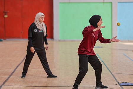 A Palestinian female Baseball player Rola Shokry hits the ball as she participates in a Baseball Championship training at Al-Ahly playground. The Palestinian Federation of Baseball and Softball organizes a Baseball 5 championship for women in Gaza City in preparation for participating in the 2023 Baseball World Cup for Women in Indonesia next November.