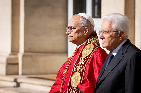 Pope Leo XIV is welcomed by Italian President Sergio Mattarella as he arrives at the Quirinale Presidential Palace