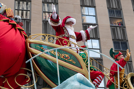 Santa Claus, Mrs. Claus and Elfs seen on Santas Sleigh float during the Macy's Annual Thanksgiving Day Parade on November 27, 2025 in New York City.