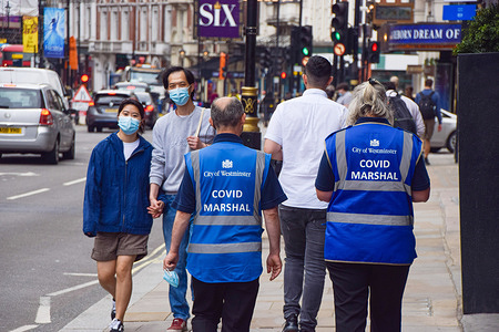 COVID-19 Marshals seen on patrol in Shaftesbury Avenue, central London, as coronavirus infections continue to rise again in England.