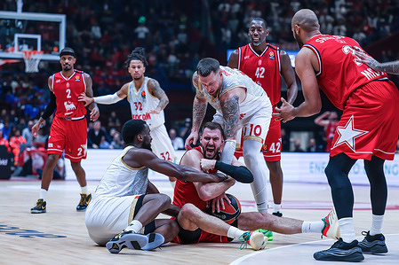 (C) Marko Guduric #23 of EA7 Emporio Armani Milano, (R) Daniel Theis #10 of AS Monaco and (L) Alpha Diallo #11 of AS Monaco seen in action during the Turkish Airlines EuroLeague 2025/26 Regular Season Round 3 game between EA7 Emporio Armani Milan and AS Monaco at Unipol Forum. Final score; EA7 Milano 79:82 AS Monaco