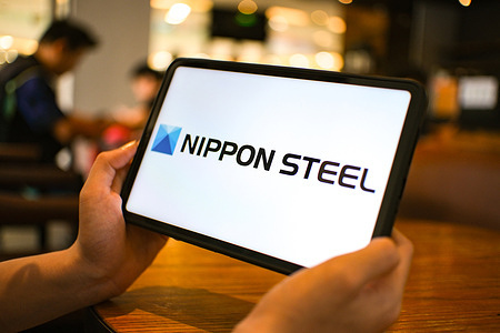 In this photo illustration, the Nippon Steel logo is seen displayed on a tablet screen.