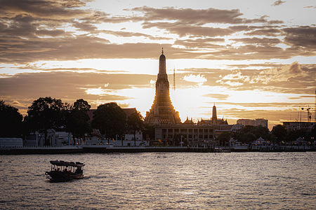 The iconic Temple of Dawn is silhouetted against glowing skies as a small boat crosses the river in the foreground. The silhouette of Wat Arun’s central pagoda stands against a dramatic sky as the sun sets over Bangkok. Thailand's iconic Wat Arun, or Temple of Dawn, has been added to UNESCO’s Tentative List of World Heritage Sites. Overlooking the Chao Phraya River in Bangkok, the central pagoda is celebrated for its cultural, historical, and architectural significance. The Ministry of Culture and Fine Arts Department will now begin the formal nomination process to secure full UNESCO recognition.