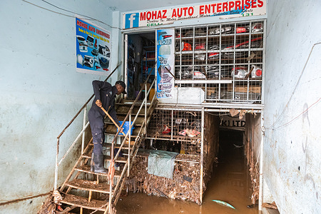 A trader cleans a flood-damaged second-hand car parts shop along Grogan Road after floodwaters disrupted businesses in the area. Heavy rains that pounded Nairobi, Kenya, on Friday, March 6, 2026, triggered flash floods that overwhelmed roads and drainage systems, leaving parts of the city submerged and damaging businesses and motor vehicles. At Grogan Road, a busy hub for second-hand vehicle parts near the Nairobi River, mechanics and traders continued salvaging usable parts after floodwaters swept through roadside garages, spare-parts shops and stalls along the road.