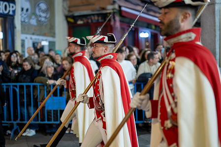 Members of the Royal Guard participate in the procession of the Brotherhood of the Holy Christ of the Halberdiers during the Holy Week. Good Friday processions through the streets of Madrid's historic center. Up to five brotherhoods processed through the heart of the Spanish capital on the evening of Good Friday, including the Divine Captive, Jesus of Nazareth of Medinaceli, the Holy Christ of the Halberdiers, Our Lady of Sorrows, and the Holy Burial. As has become customary in recent years, all the processions passed through the Puerta del Sol square, where thousands of local faithful and tourists gathered.