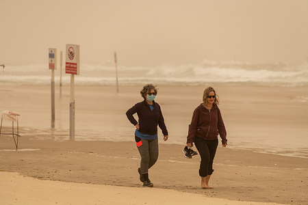 A couple seen walking on the empty beach of Tel Aviv during the sandstorm. A rare sandstorm originating in the deserts of North Africa hit the Middle East and Israel. In the Mediterranean city of Tel Aviv, Israel, the storm's impact was felt everywhere. The beaches, which are usually bustling with life on weekends, were almost empty and many people wore masks to prevent breathing in dust particles. According to air pollution indicators, Tel Aviv was the most polluted city in the world on Saturday, February 14th.