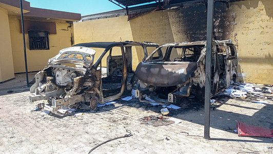 Burnt vehicles seen after the demonstration. Aftermath of destroyed government buildings by protesters who marched in the streets of the capital Tripoli, many attacked and setted fire to government buildings, including the House of Representatives in the eastern city of Tobruk because of the deteriorating living conditions in Lybia. Calm appeared to have returned to Tobruk, though there were calls on social media for more protests in the evening.
