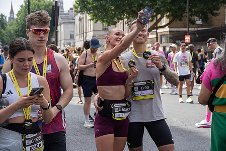 A couple takes a selfie after the finish line on the Whitehall. The Saucony London 10K is an annual 10 kilometre (6.2 mile) long running event from the Green Park to the Whitehall. This year around 17,000 people attended the competition.