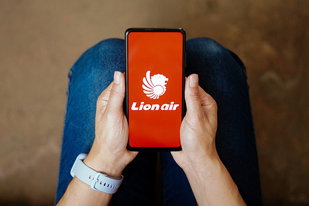 In this photo illustration, the Lion Air logo seen displayed on a smartphone.