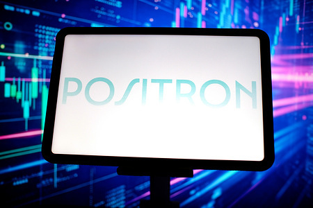 In this photo illustration, the Positron logo is displayed on a tablet screen.