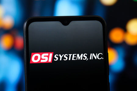 In this photo illustration, the OSI Systems logo is seen displayed on a smartphone screen.