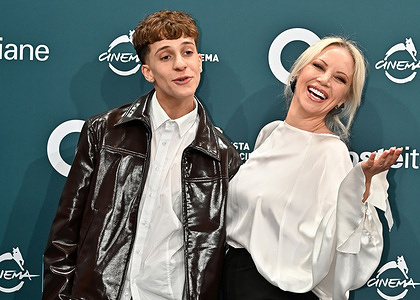 Mattia Francesco Cozzolino and Nunzia de Stefano attend the photocall for the film "Malavia" at the 2025 Rome Film Festival.