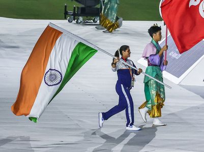 Indiaís shooter Neeru Dhanta proudly carries the Indian national flag during the Closing Ceremony of the 20th Asian Games Aichi-Nagoya 2026 at Nagoya, marking the conclusion of a memorable continental sporting celebration.