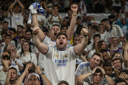 Real Madrid fans cheer their team up as they watch live on large screens the 2022 UEFA Champions League final match between Liverpool and Real Madrid at the Santiago Bernabeu stadium in Madrid. Real Madrid won its 14th championship after beating Liverpool 1-0 at the Stade de France in Saint-Denis stadium in France.
