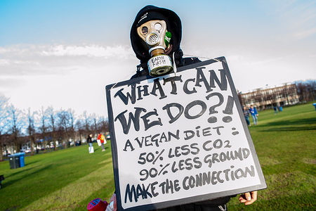 A student is seen holding a big placard while he is wearing a mask during the demonstration.
Thousands of Dutch students inspired by recent protests organized by students in Belgium skipped school for better climate policy. Every Thursday, students of the Netherlands, will strike against the failing climate policies and the downfall of our planet. The first strike took place on the 7th of February on the Mailieveld in The Hague.