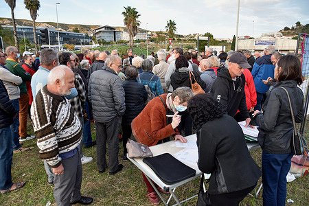 Protesters seen signing a petition during the demonstration.Residents of the northern districts of Marseille have gathered to protest against excessive pollution from cruise ships.