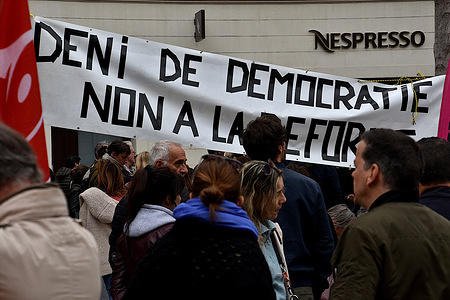 Protesters hung a banner during the demonstration. At the call of several trade unions, more than a thousand people gathered on Place General de Gaulle to protest against the pension reform wanted by the French government and which would push back the retirement age from 62 to 64 years old.