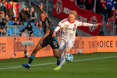 Souleyman Doumbia #21 (L) and Ola Brynhildsen #9 (R) seen in action during the MLS game between Toronto FC and Charlotte FC at BMO field. The game ended 2-0 for Charlotte FC.