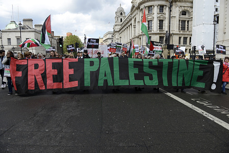 Protesters are seen holding flags, placards and a banner that says free Palestine during the demonstration.
Palestinian human rights activist Ahed Tamimi joined the National demo for Palestine. Protesters gathered at Portland Place and marched to Whitehall in London, joining a global demonstration to show solidarity for Palestinian citizens and also to demand respect for the Palestinians rights and defend the rights to return to their territory.