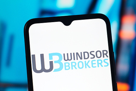 In this photo illustration, the Windsor Brokers (WB) logo is seen displayed on a smartphone screen.
