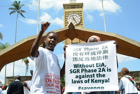 Protesters are seen outside  Parliament buildings in Nairobi during a demonstration against the construction of the second phase of standard gauge railway through the Nairobi National Park. Conservationist are against the construction citing the negative impact it will have at the park.