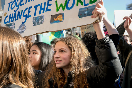 A female student holds up a placard during the Climate Strike. Thousands of primary school children, teenagers and university students have walked out of lessons today in more than 40 cities and towns of the UK to protest against climate change and urge the government to take action.
The global movement has been inspired by teenage activist Greta Thunberg, who has been skipping school every Friday since August to protest outside the Swedish parliament.