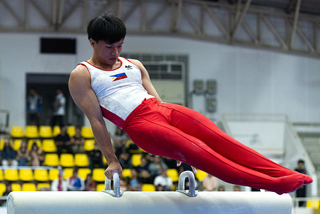 Jhon Romeo Santillan from Philippines competes on the pommel horse event during the Artistic Gymnastics preliminary round in 33rd SEA Games at gymnasium 5 Thammasat University.