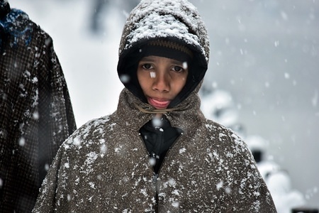 A boy seen walking through a snow covered street during fresh snowfall in Srinagar, Indian administered Kashmir.
Fresh snowfall affected life across the Kashmir valley. The National Highway remained closed for the second consecutive day and flight services to and from Srinagar were canceled.
The weather man has forecast improvement in weather conditions from Feb 8.