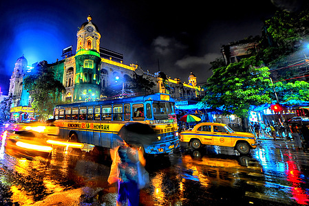 Vehicles move with high speed after heavy rains in kolkata . The Slow shutter camera exposure against the speed of the cars creates a light trail motion in the pictures .