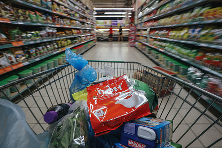 A shopping cart filled with groceries at a super market as citizens buy bulks of necessities following a CMCO (Conditional Movement Control Order) re-imposed by Malaysian government for two weeks as cases spike amid concerns of the coronavirus (Covid-19).