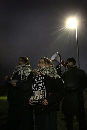 A protester holds a placard saying ‘Justice For The Hunger Strikers’ during the rally. Supporters of the Filton 24 pro-Palestine prisoners rallied outside Peterborough prison in solidarity with the 24 on remand and those six currently on hunger strike in prisons across the UK. Teuta Hoxha is currently in HMP Peterborough. The prisoners have been on remand for at least a year since being arrested for targeting the Filton site of Israeli arms company Elbit Systems in Bristol and destroying quadcopter drones the protesters say were destined for use against Palestinians in Gaza. The hunger striking prisoners are making five demands of the government : to end all censorship and surveillance of communications, immediate bail, a fair trial, de-proscription of Palestine Action and to shut down Elbit Systems.