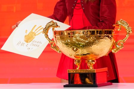 Qinwen Zheng of China displays a framed gold handprint at a press conference at a press conference after defeating Mirra Andreeva in their women's singles final match on day eleven of China Open at the National Tennis Center. Qinwen Zheng defeated Mirra Andreeva 7-5, 6-4