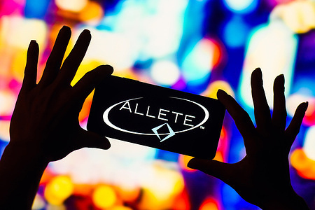 In this photo illustration, the Allete, Inc. logo is displayed on a smartphone screen.