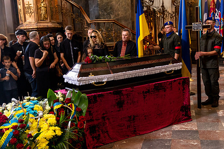 Family morns during the funeral of a serviceman, killed by the Russian army in Saint Peter and Paul Cathedral in the old town of Lviv. Senior Lieutenant Mykhailo Gamkalo, was also associate professor of the Department of Tourism of Lviv University. The city of Lviv selected a separate slot of land in the cemetery for the soldiers fallen in the fight with Russia, the soldiers are highly regarded as national heroes. on the same day, Ukrainians celebrated Independence Day, as well as marking 6 months of war with Russia on August 24.